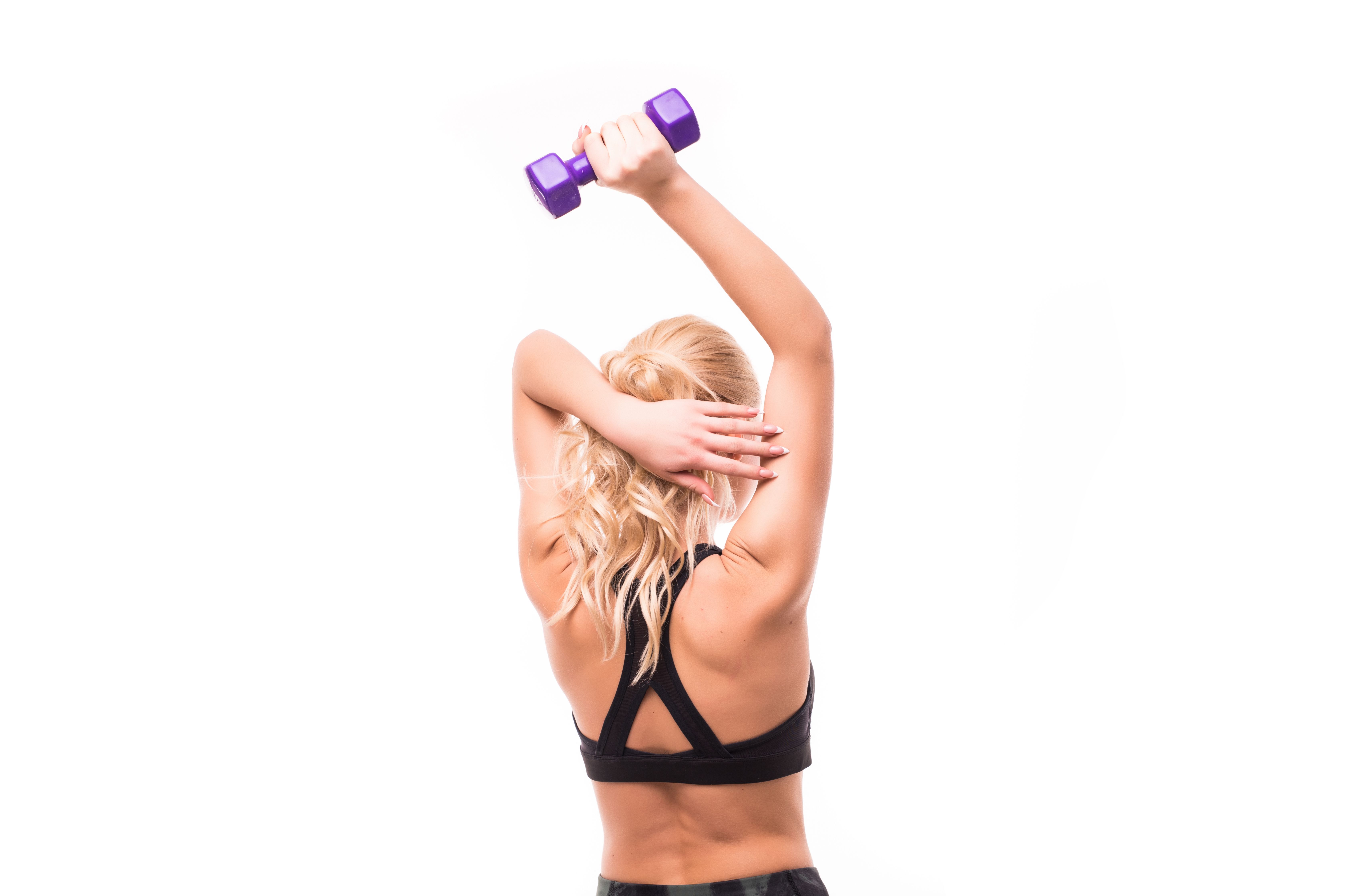 beauty-black-top-exercises-her-back-with-elegant-dumbbells (2).jpg