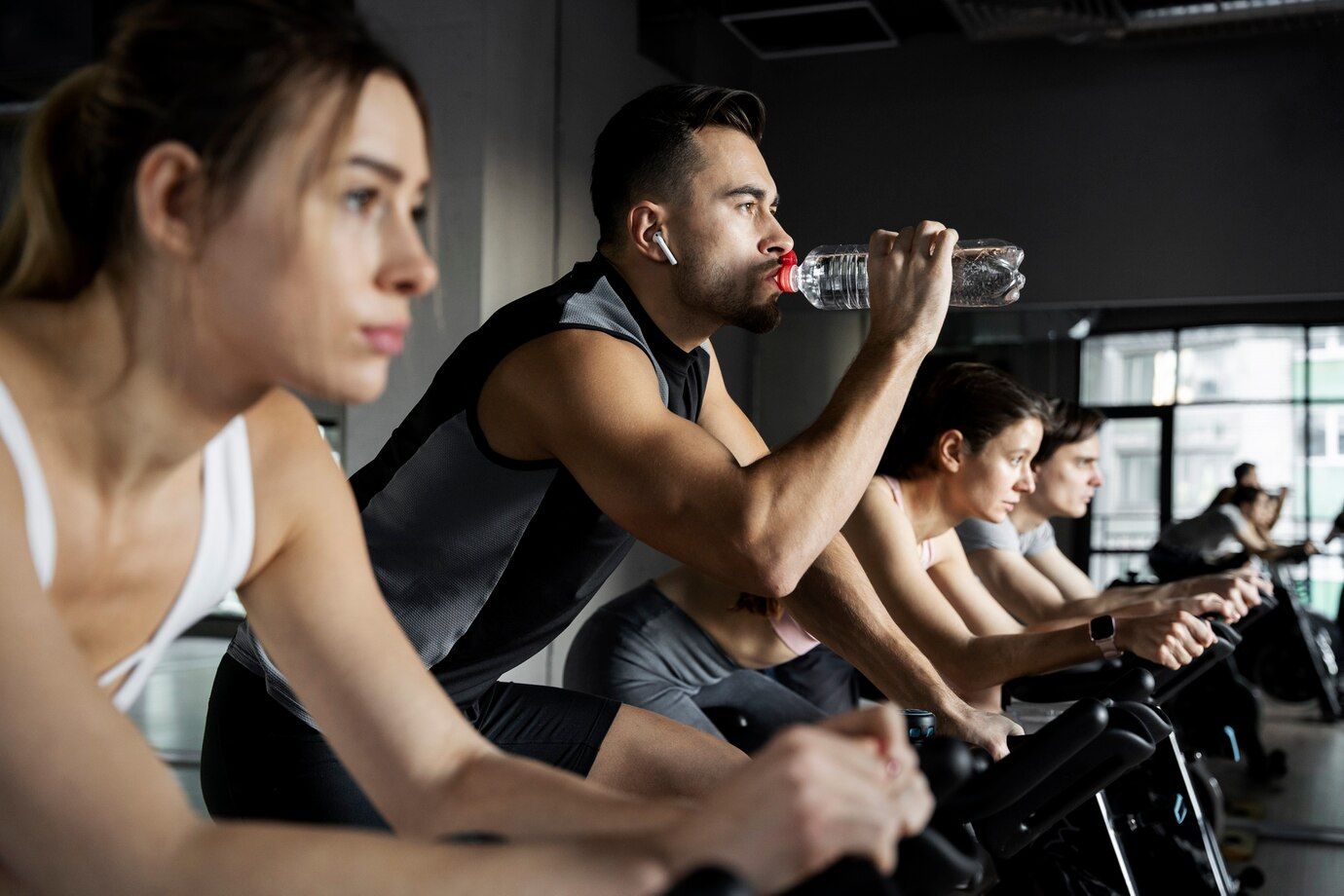 people-doing-indoor-cycling_23-2149270267.jpg