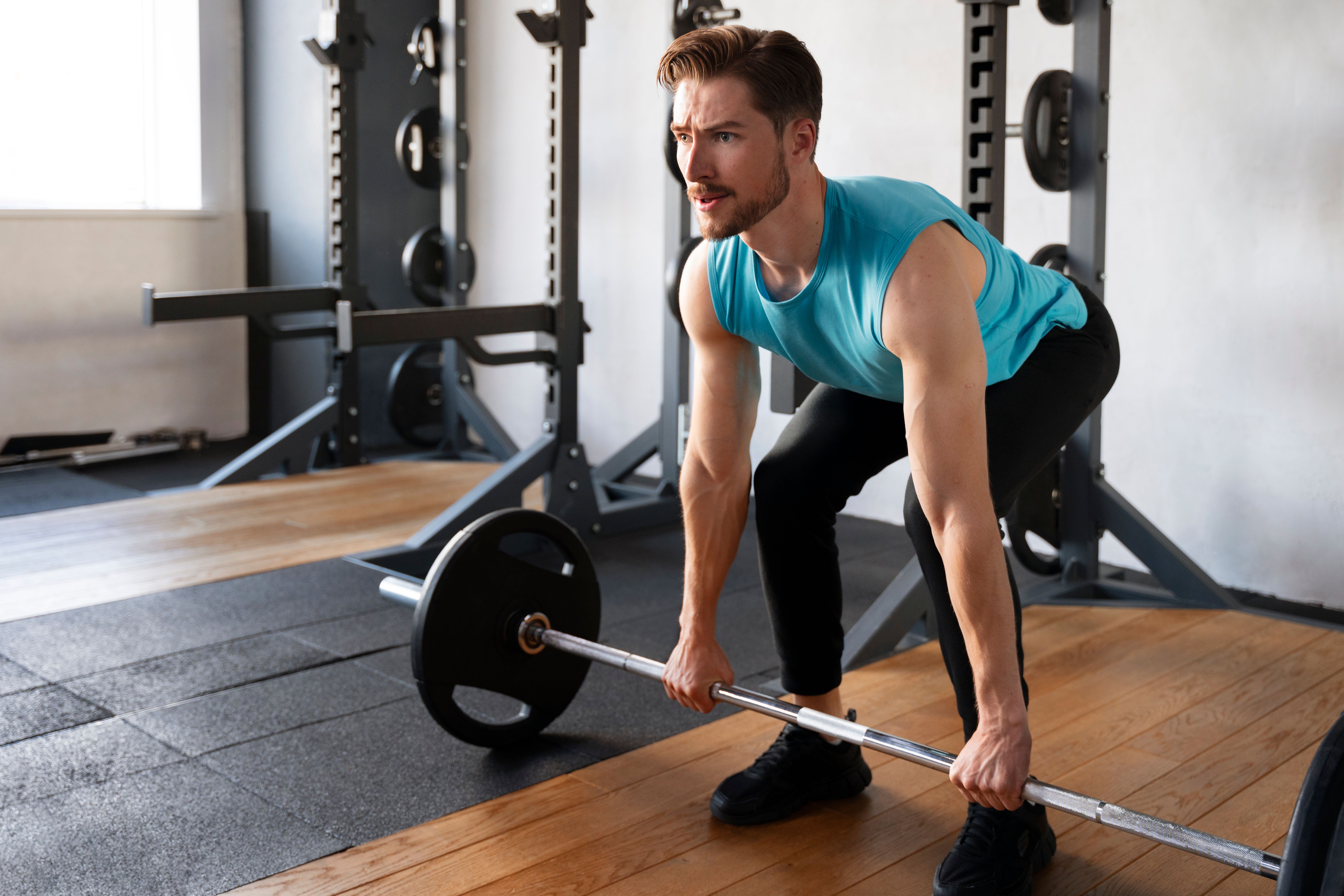 young-handsome-man-exercising-gym-bodybuilding.jpg